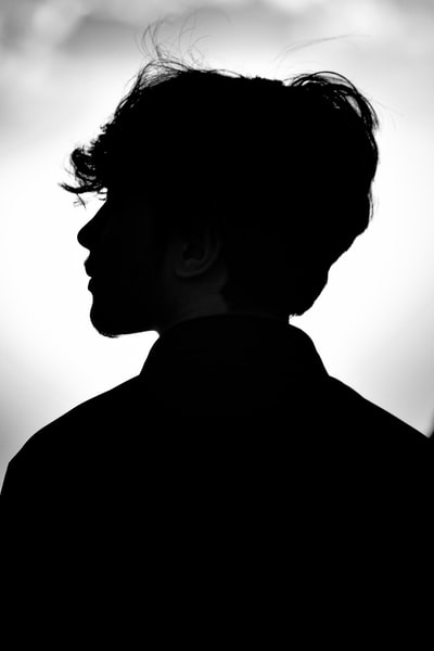 silhouette of man in black shirt